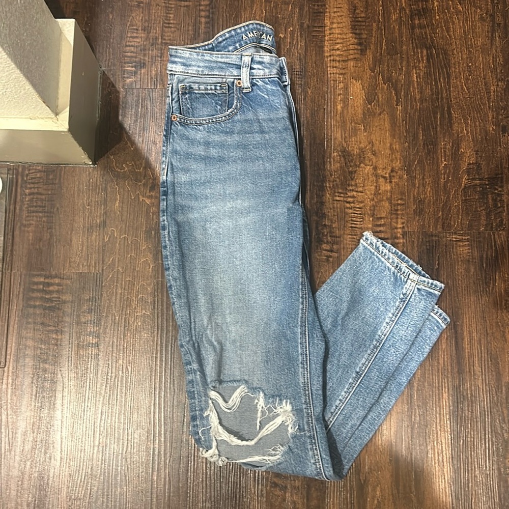 Blue denim Amerrican Eagle jeans with distress.